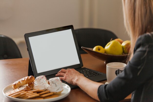 Woman in front of laptop screen