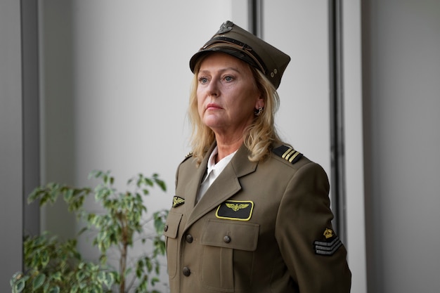 Free photo woman general in uniform side view