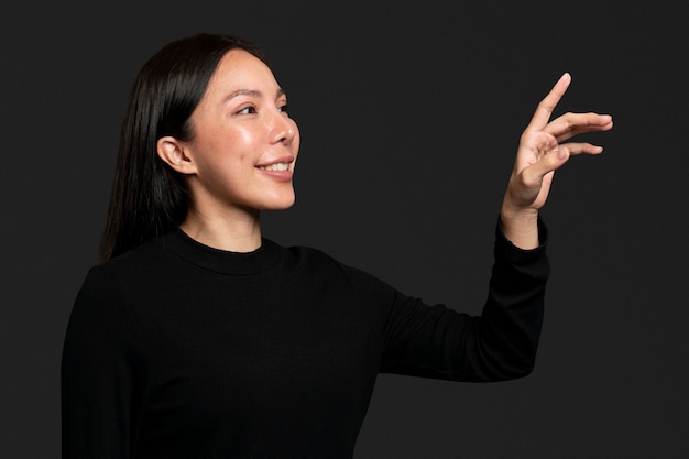 Woman gesture pressing on an invisible screen