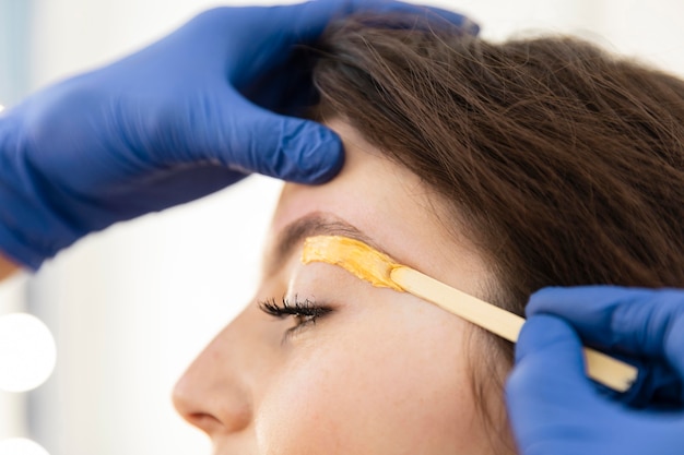 Woman getting an eyebrow treatment