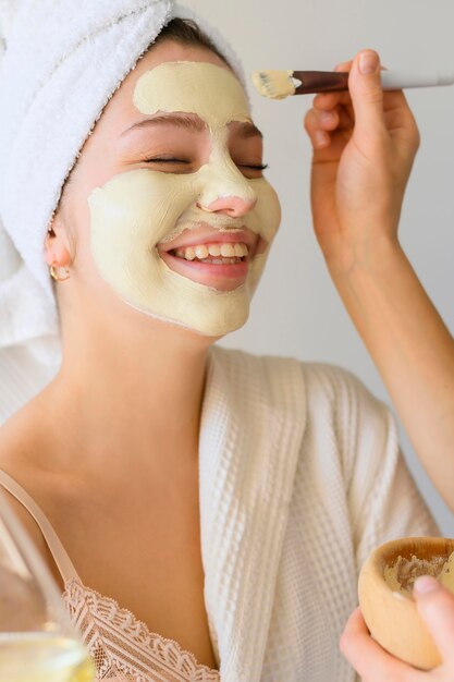Woman getting a face mask at home