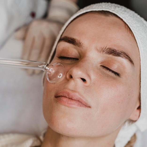 Woman getting a facial skin treatment at the wellness center