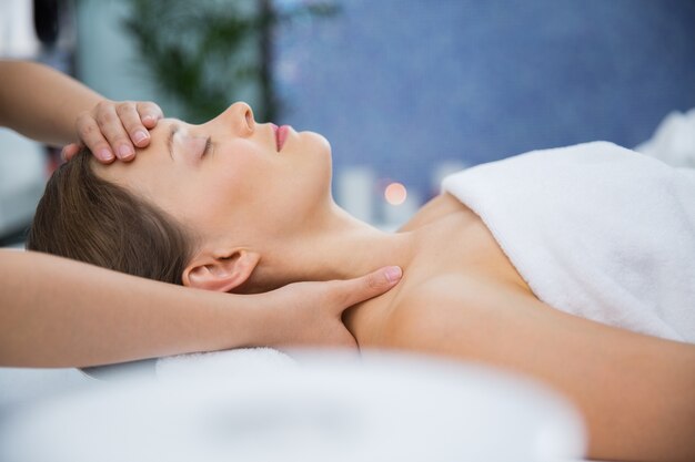 Woman getting a head massage