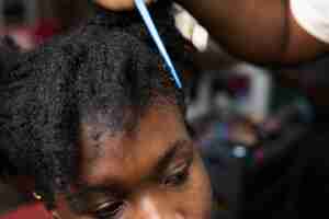 Free photo woman getting her hair done at the beauty salon