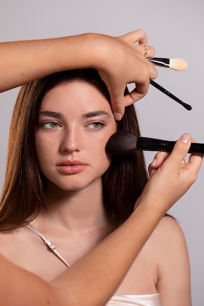 Woman getting her make up done by a professional