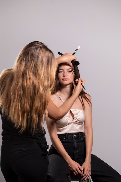 Woman getting her make up done by a professional
