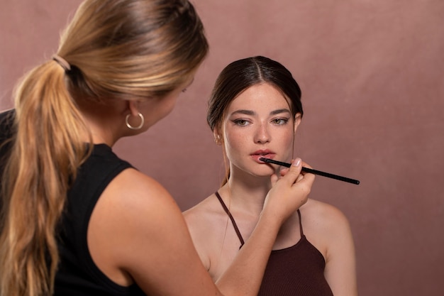 Woman getting her make up done by a professional