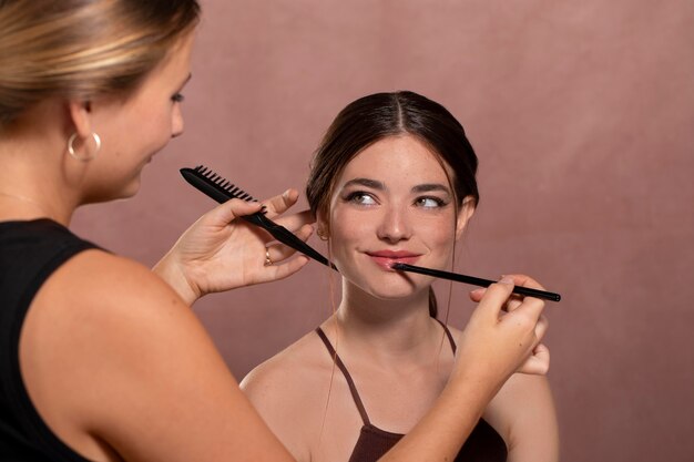 Woman getting her make up done by a professional