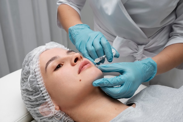 Woman getting injection at clinic