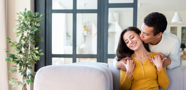 Woman getting kissed on the cheek