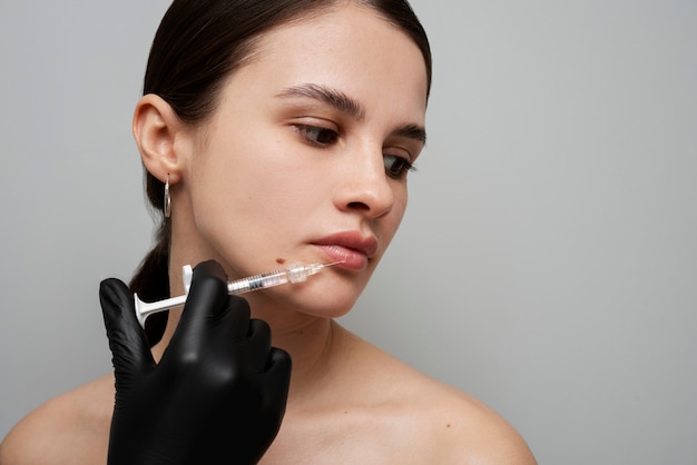 Woman getting lip fillers side view