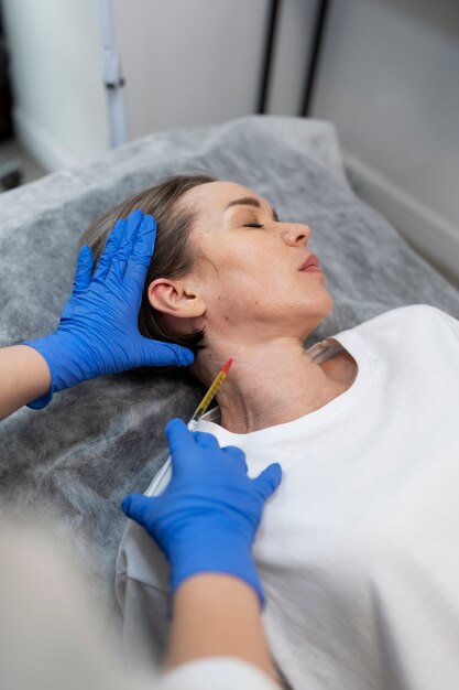 woman getting prp injection high angle