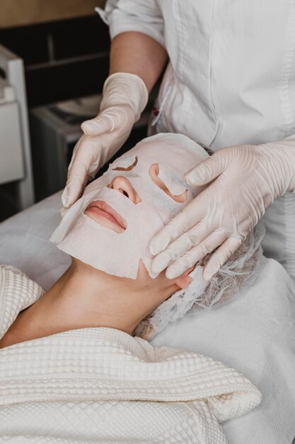 woman getting a skin mask treatment