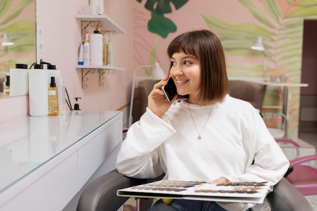 Free photo woman getting treatment at hairdresser shop