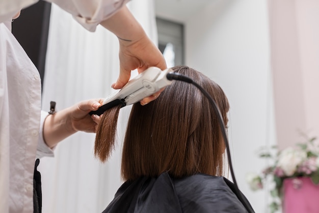 Free photo woman getting treatment at hairdresser shop