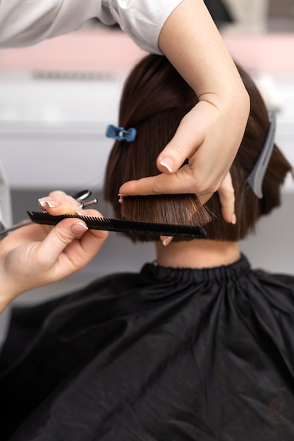 Free photo woman getting treatment at hairdresser shop