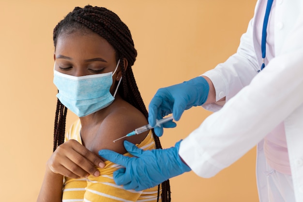 Woman getting vaccinated close up