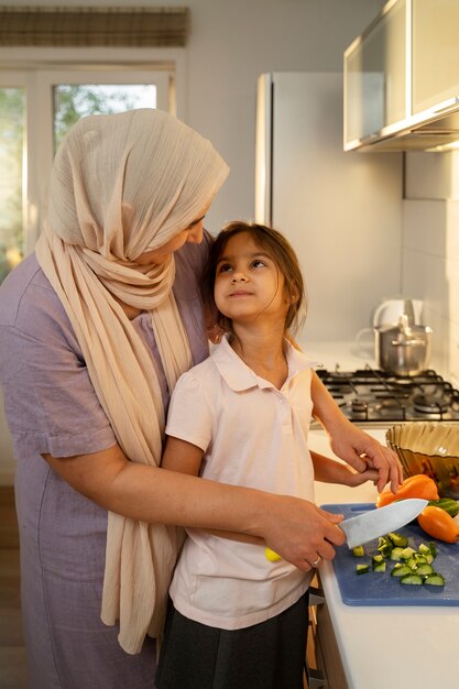 Woman and girl cooking medium shot