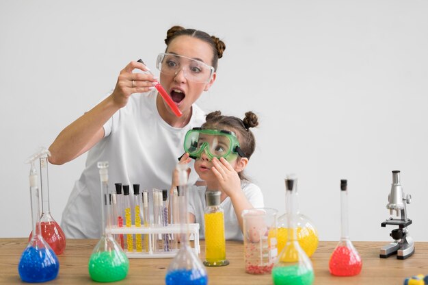woman and girl with safety glasses