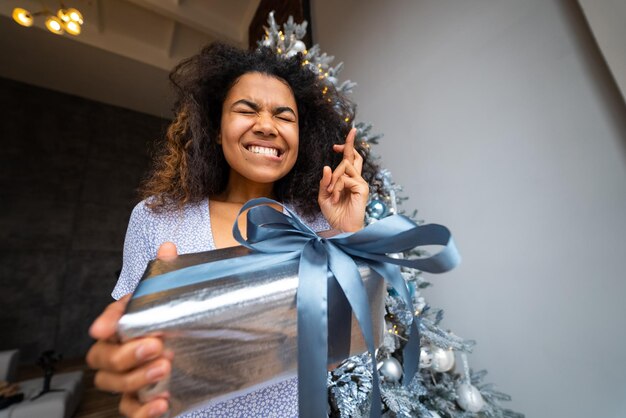 Woman gives a gift to his friend in the camera