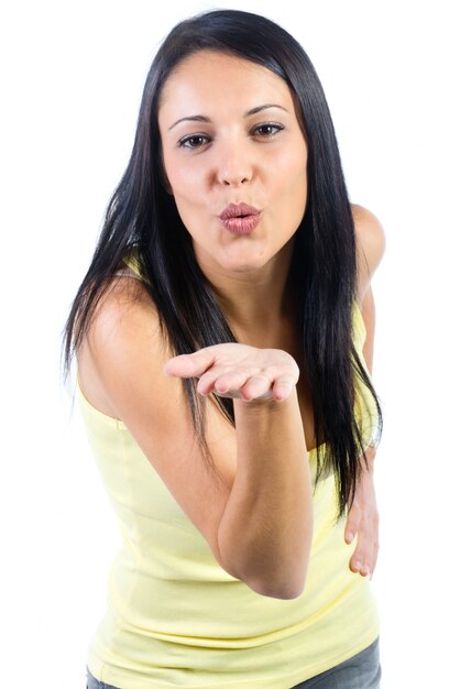 "Woman gives a kiss to a camera"