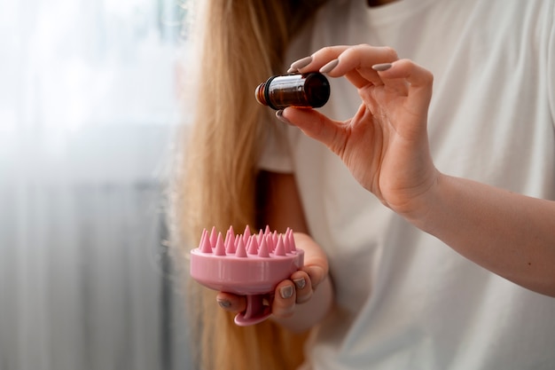 Woman giving herself scalp massage