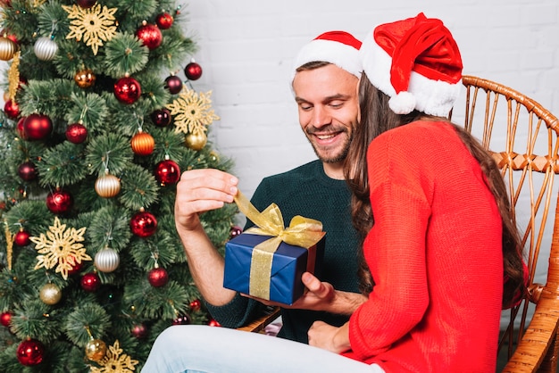 Woman giving present for man