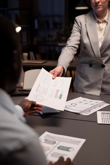 Woman giving report to her boss