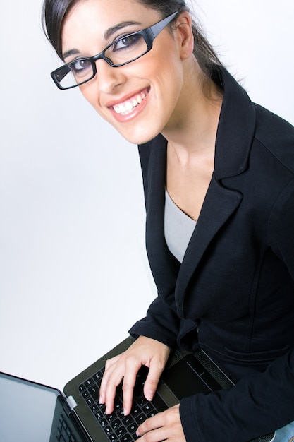 Free photo woman in glasses with laptop