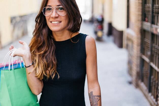 Woman in glasses with paper bags