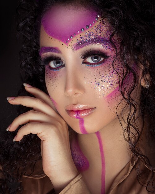 Woman in glittering pink makeup