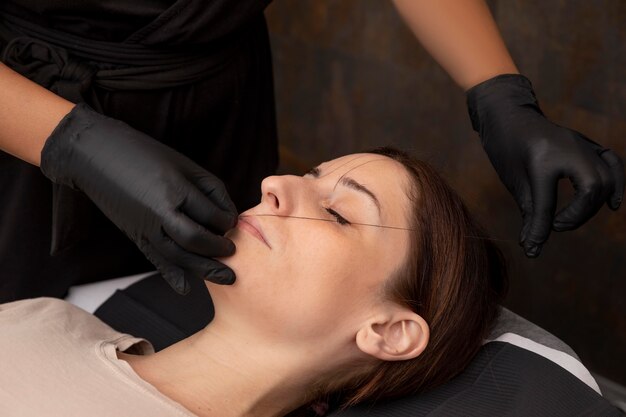 Woman going through a microblading procedure