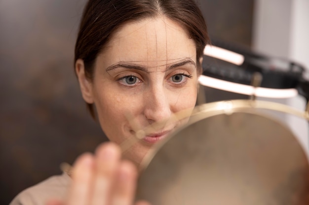 Woman going through a microblading procedure