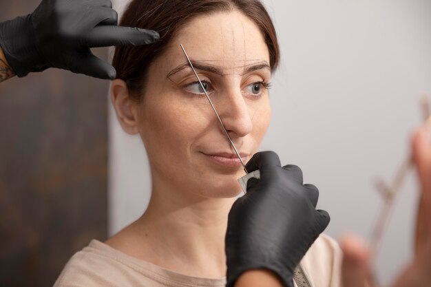 Woman going through a microblading procedure