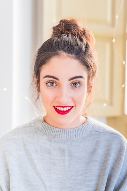 Woman in grey clothes smiling 