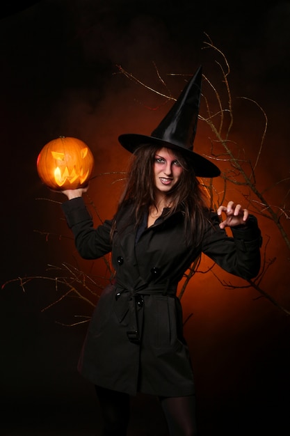 Woman in halloween witch costume