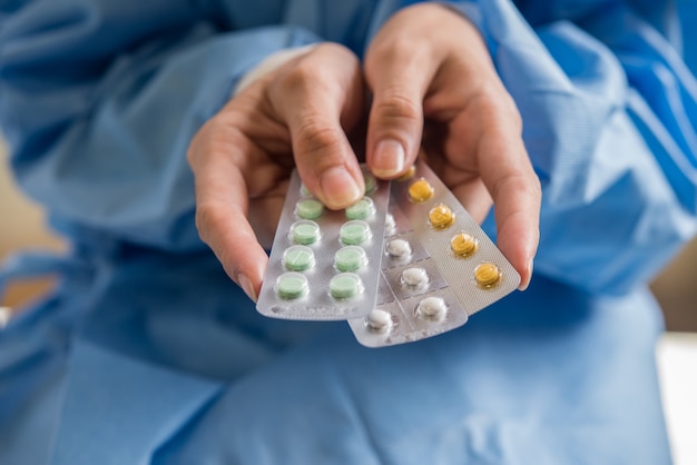 Woman hand holding a contraceptive panel prevent pregnancy