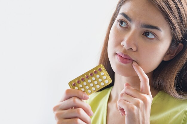 Woman hand holding a contraceptive panel prevent pregnancy