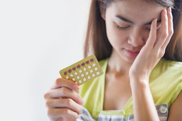 Woman hand holding a contraceptive panel prevent pregnancy