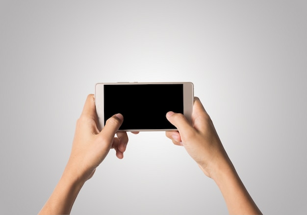 Женщина Рука держит смартфон пустой экран. Копирование пространства. Рука, проведение смартфон, изолированных на белом фоне.