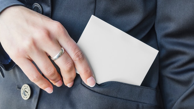 Woman hand putting card in pocket