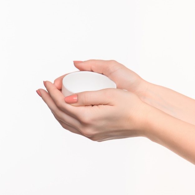 Woman hand with cup on white space