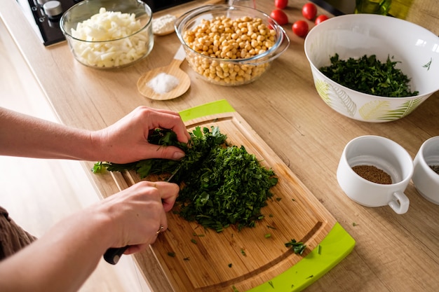 Woman hands, cutting onions