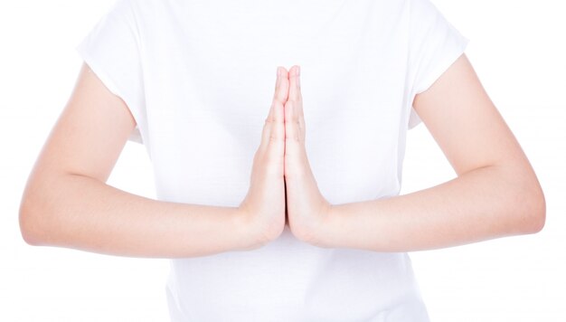 Woman hands greeting  over body isolated on background.