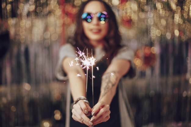 Woman hands holding sparklers