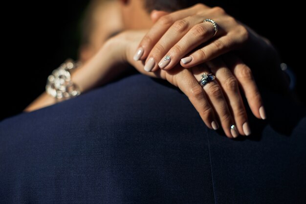 Woman hands on man's back