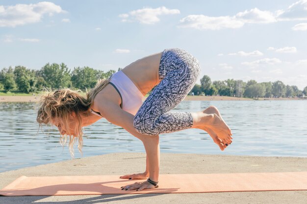 Woman on hands at river