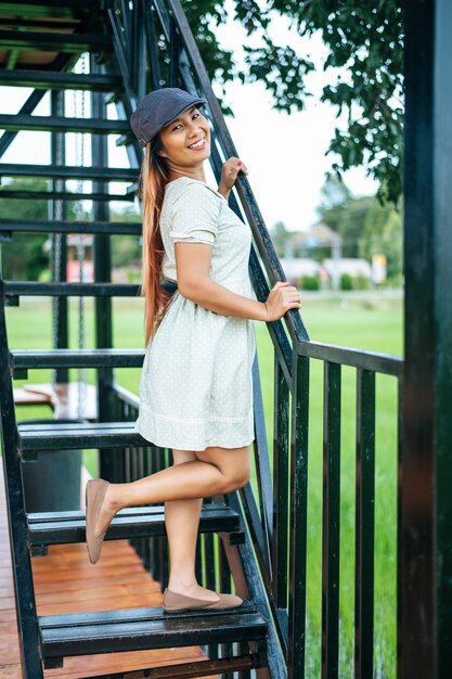 woman happily stood the stairs in the tourist sites