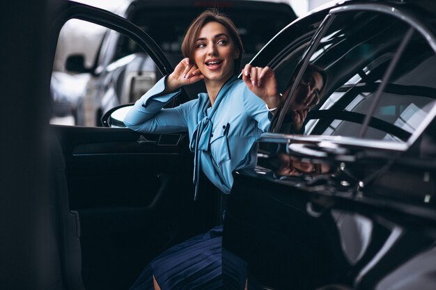 Woman happy buying a car