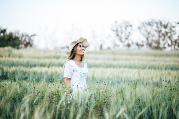 Woman in the hat happiness in the nature